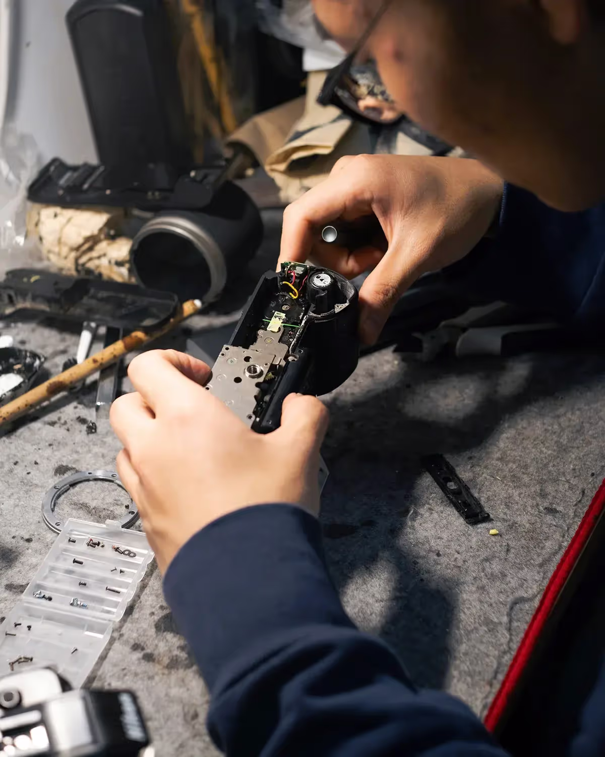 A person fixing a digital camera