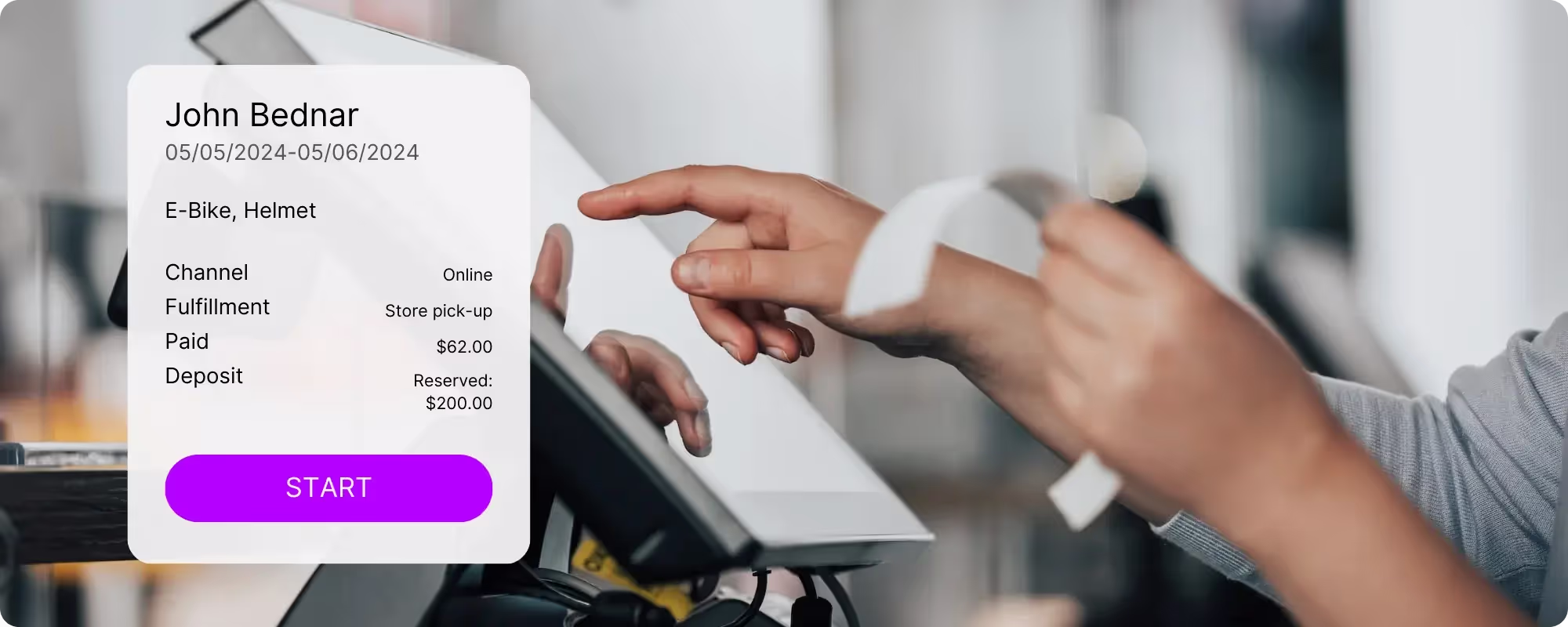 A person using a touch interface on a computer holding a receipt on her other hand.