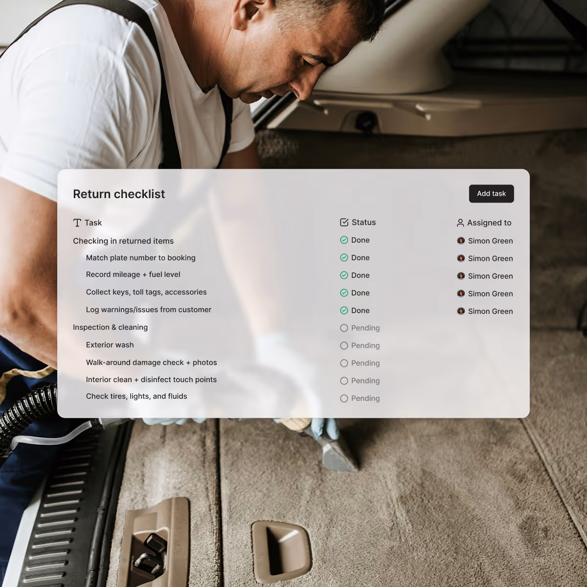 Man cleaning car interior with vacuum in the background of a car rental return checklist showing tasks, their status, and assigned person.